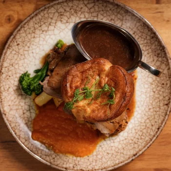 Sunday roast with Yorkshire pudding, roast potatoes, vegetables and gravy at Dolce & Blush Blackpool