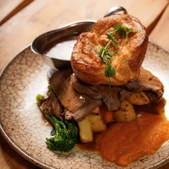 Sunday roast with Yorkshire pudding, roast potatoes, vegetables and gravy at Dolce & Blush Blackpool