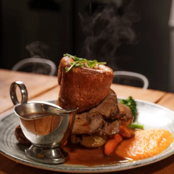 Sunday roast with Yorkshire pudding, roast potatoes, vegetables and gravy at Dolce & Blush Blackpool
