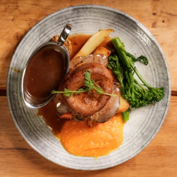 Sunday roast with Yorkshire pudding, roast potatoes, vegetables and gravy at Dolce & Blush Blackpool