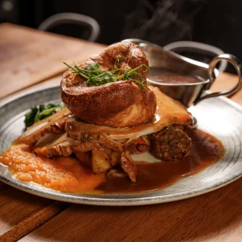 Sunday roast with Yorkshire pudding, roast potatoes, vegetables and gravy at Dolce & Blush Blackpool
