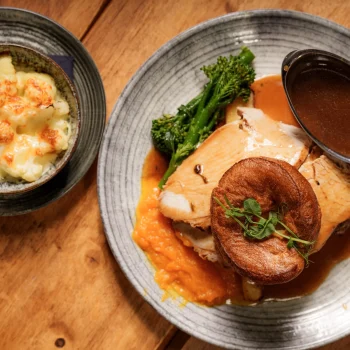 Sunday roast with Yorkshire pudding, roast potatoes, vegetables and gravy at Dolce & Blush Blackpool